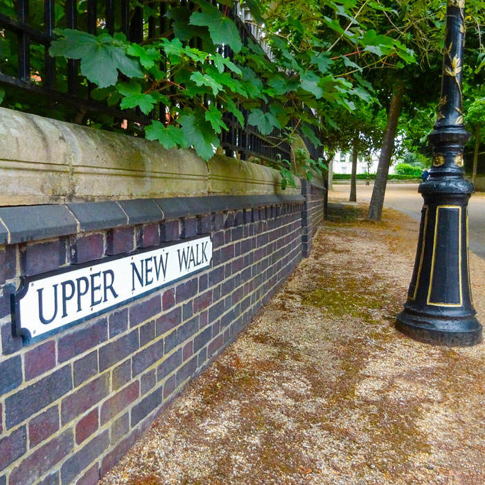 Upper New Walk showing the street sign leading up to the top and showing old black lamp posts