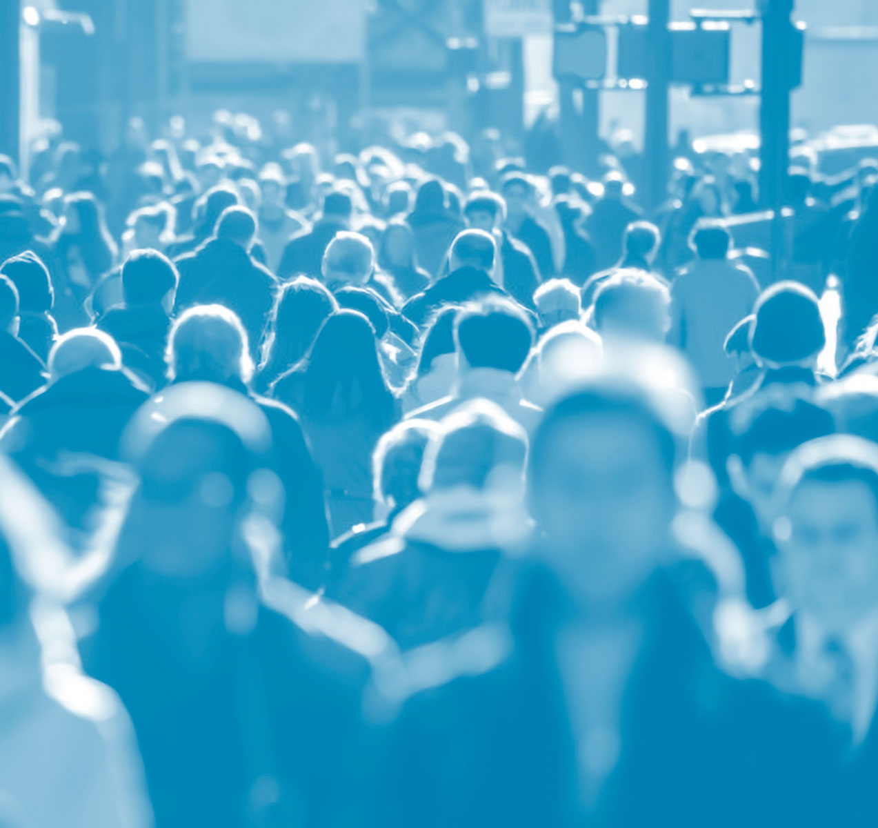 Photo of a crowd of people in a city street showing their heads